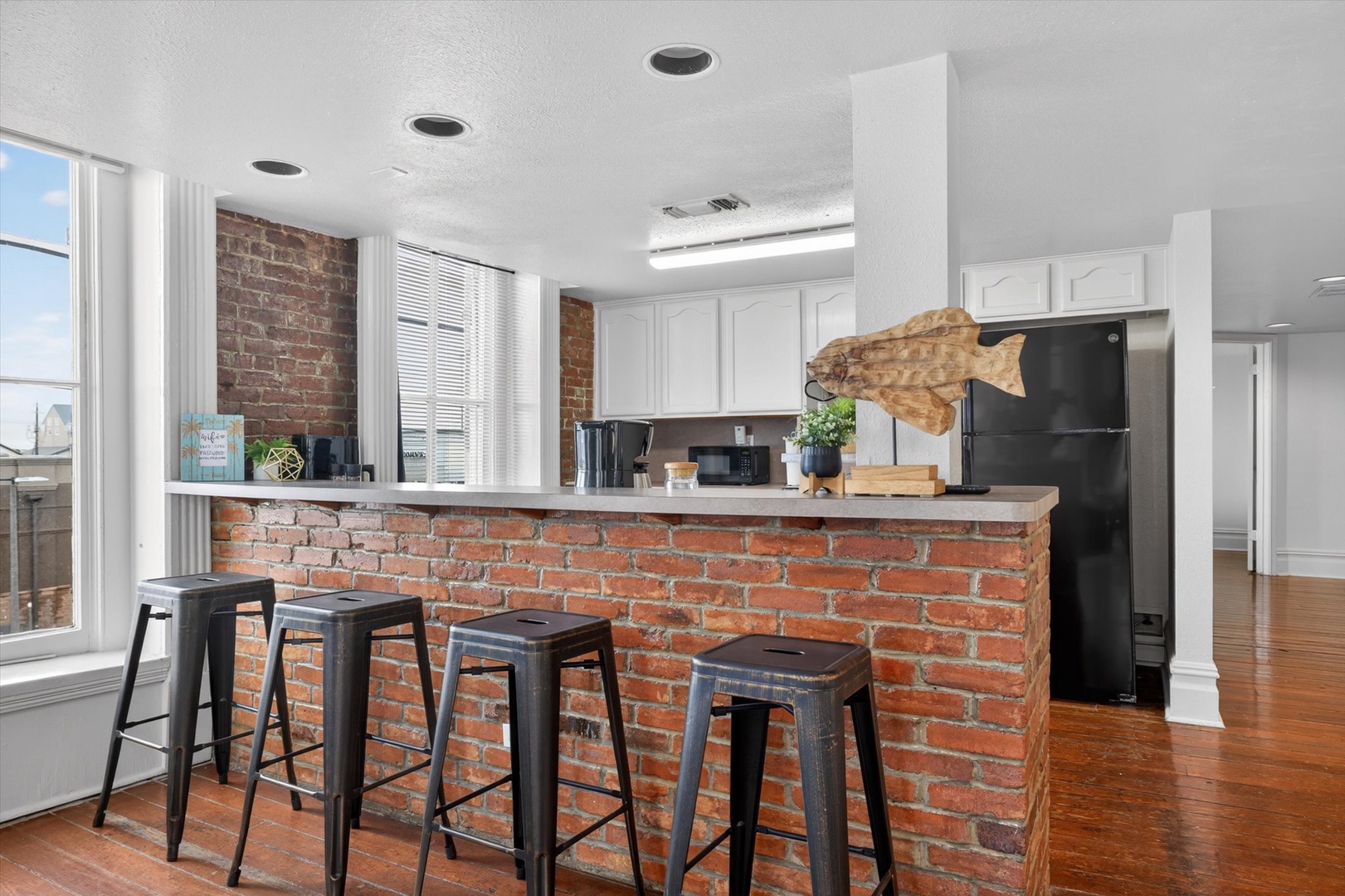 Bright breakfast bar with brick charm and natural light