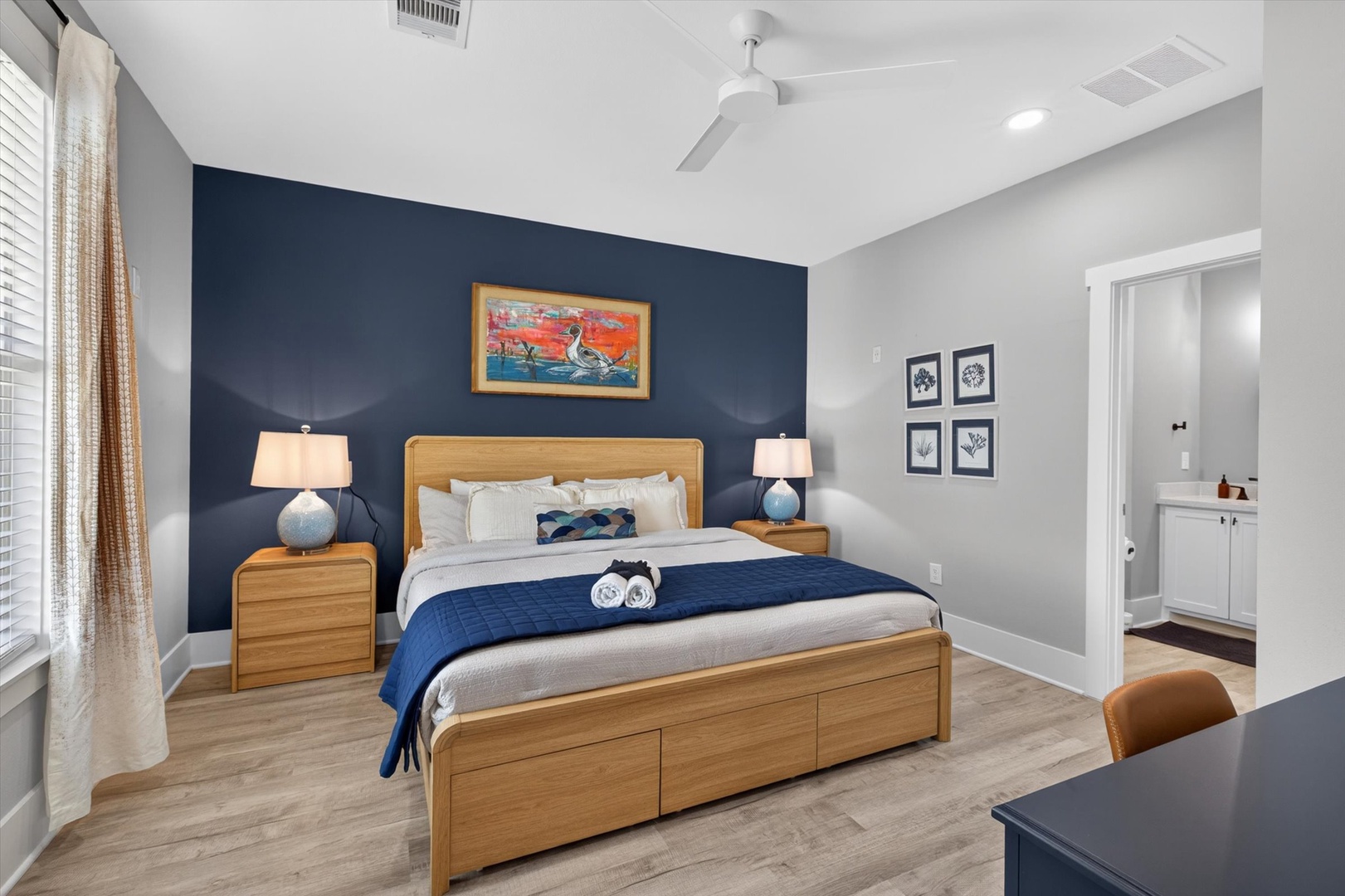 Bright bedroom with plush bed and private ensuite.