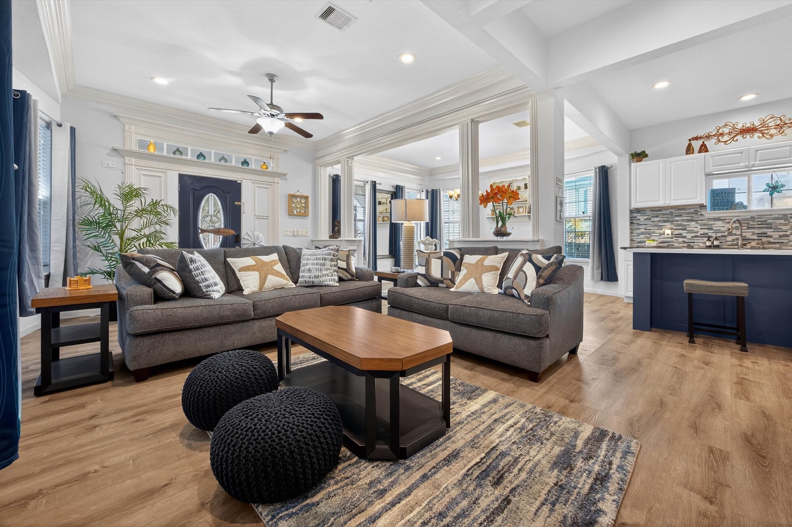 Relax in your elegantly appointed living space featuring plush seating, warm wood floors, and an open layout perfect for unwinding after exploring.