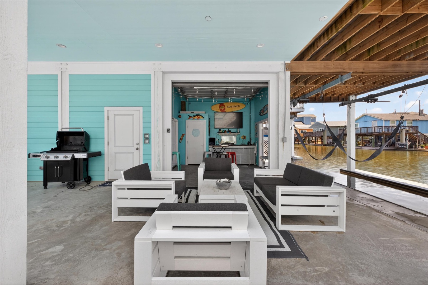 Private deck with hammocks, grill, and water views.