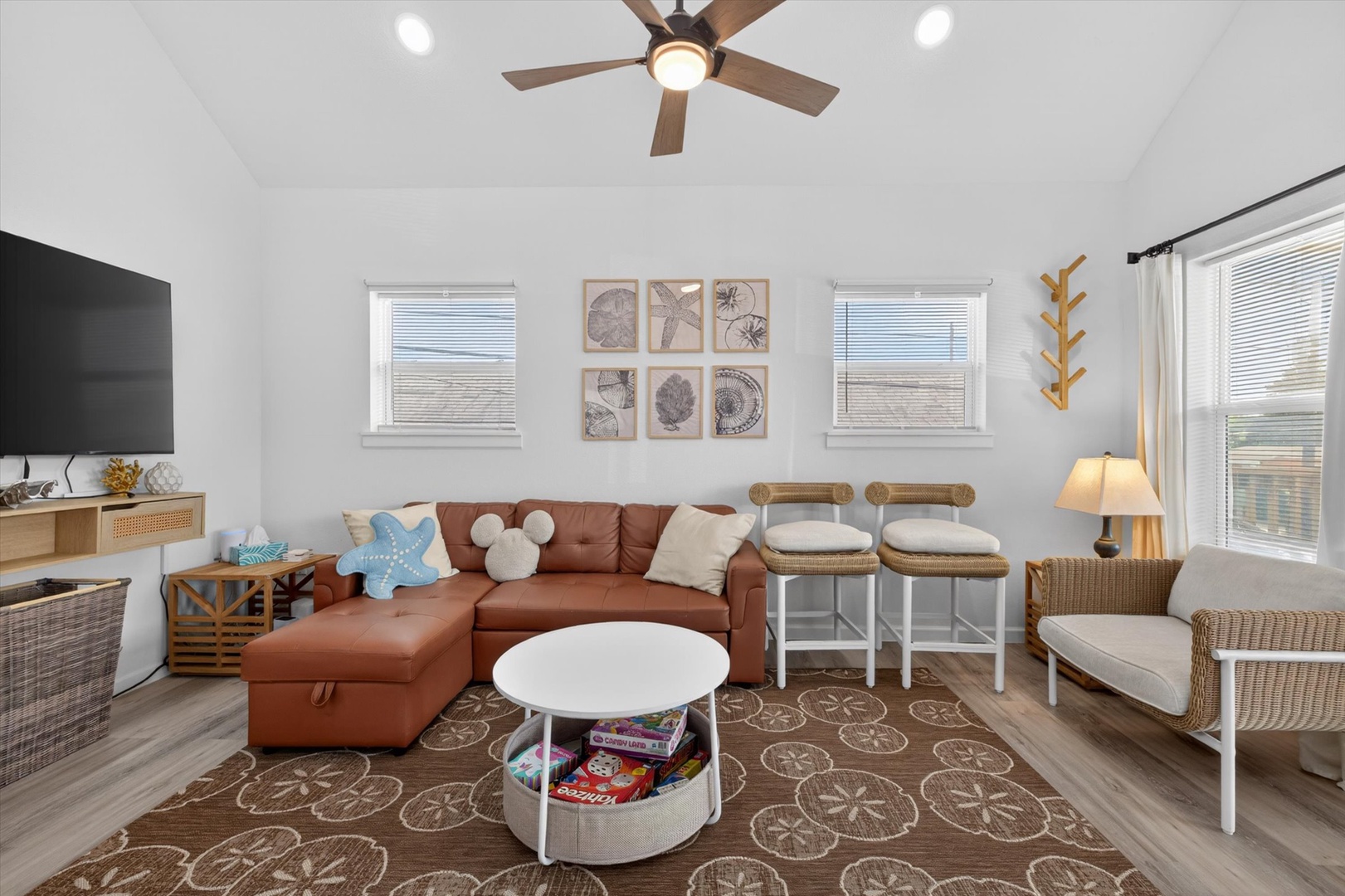 Vaulted coastal living room with sectional and cheerful decor.