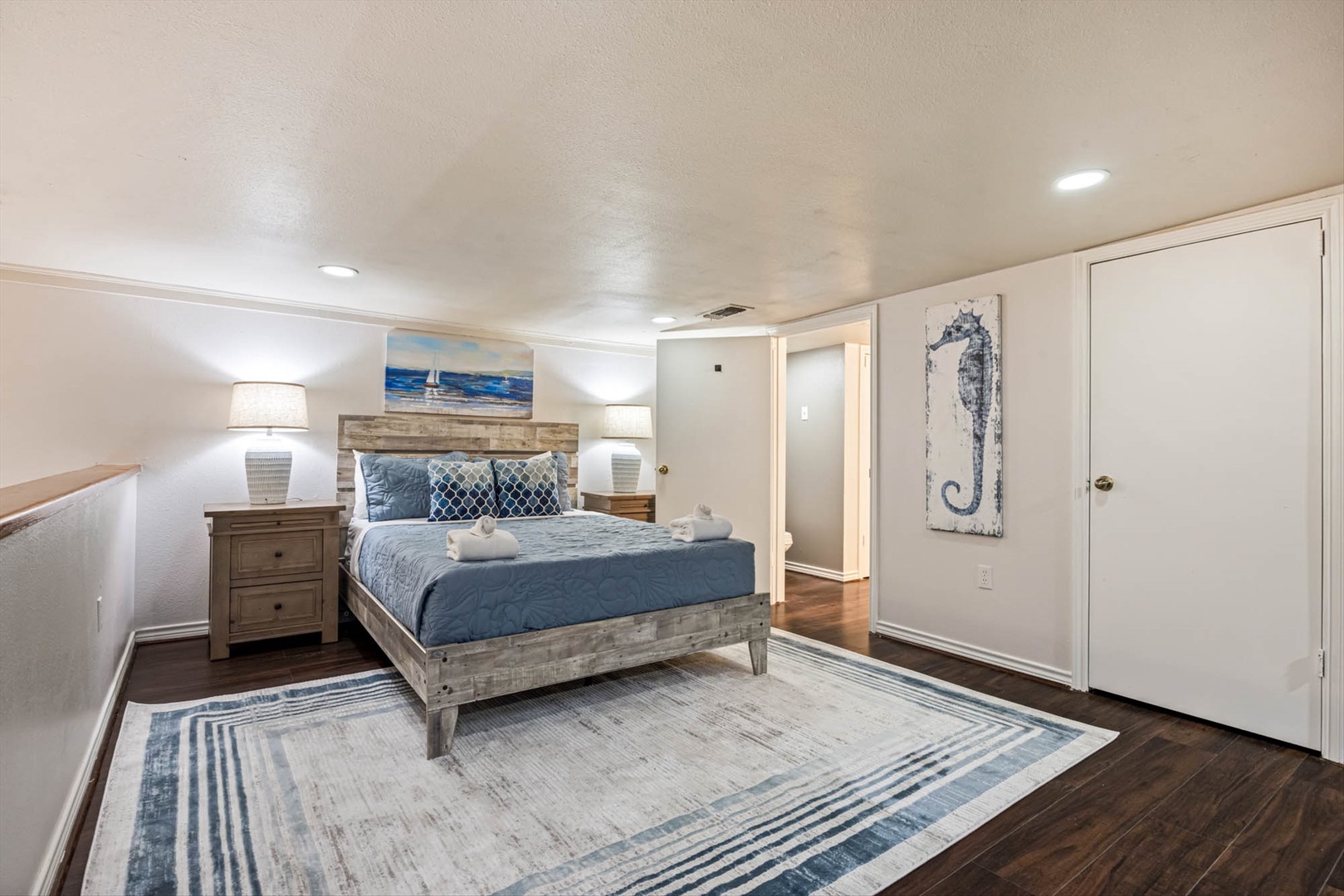 Peaceful coastal bedroom with nautical accents and ocean blues.