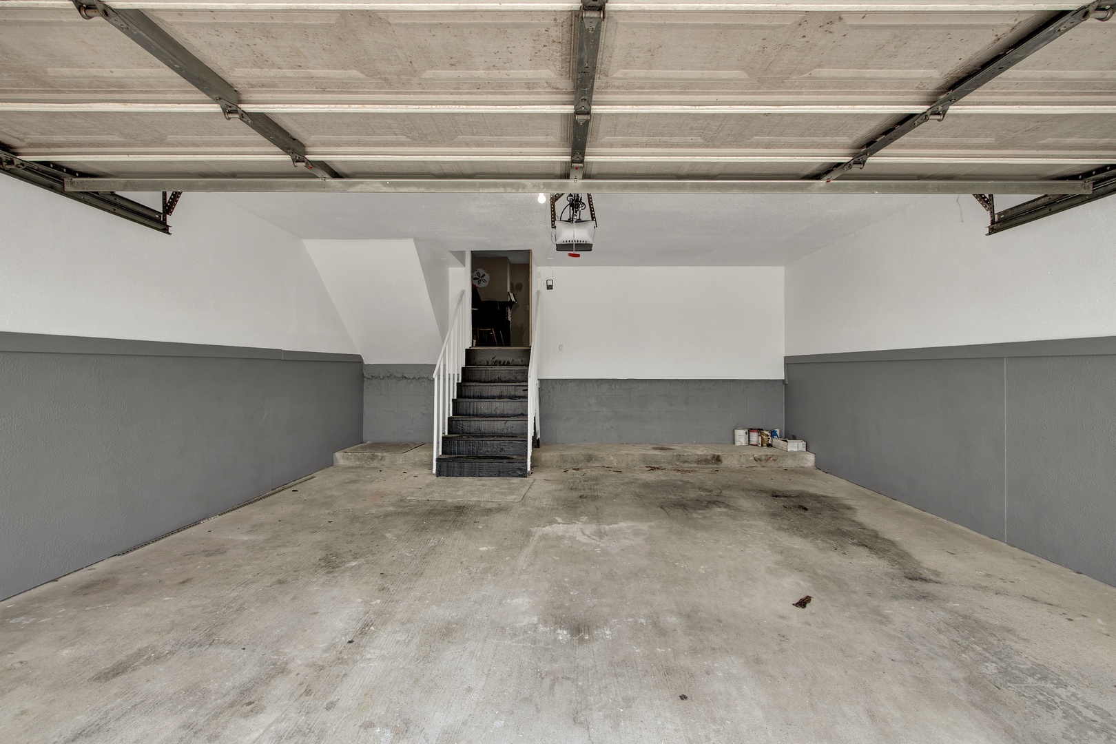 Secure two-car garage with extra storage space.