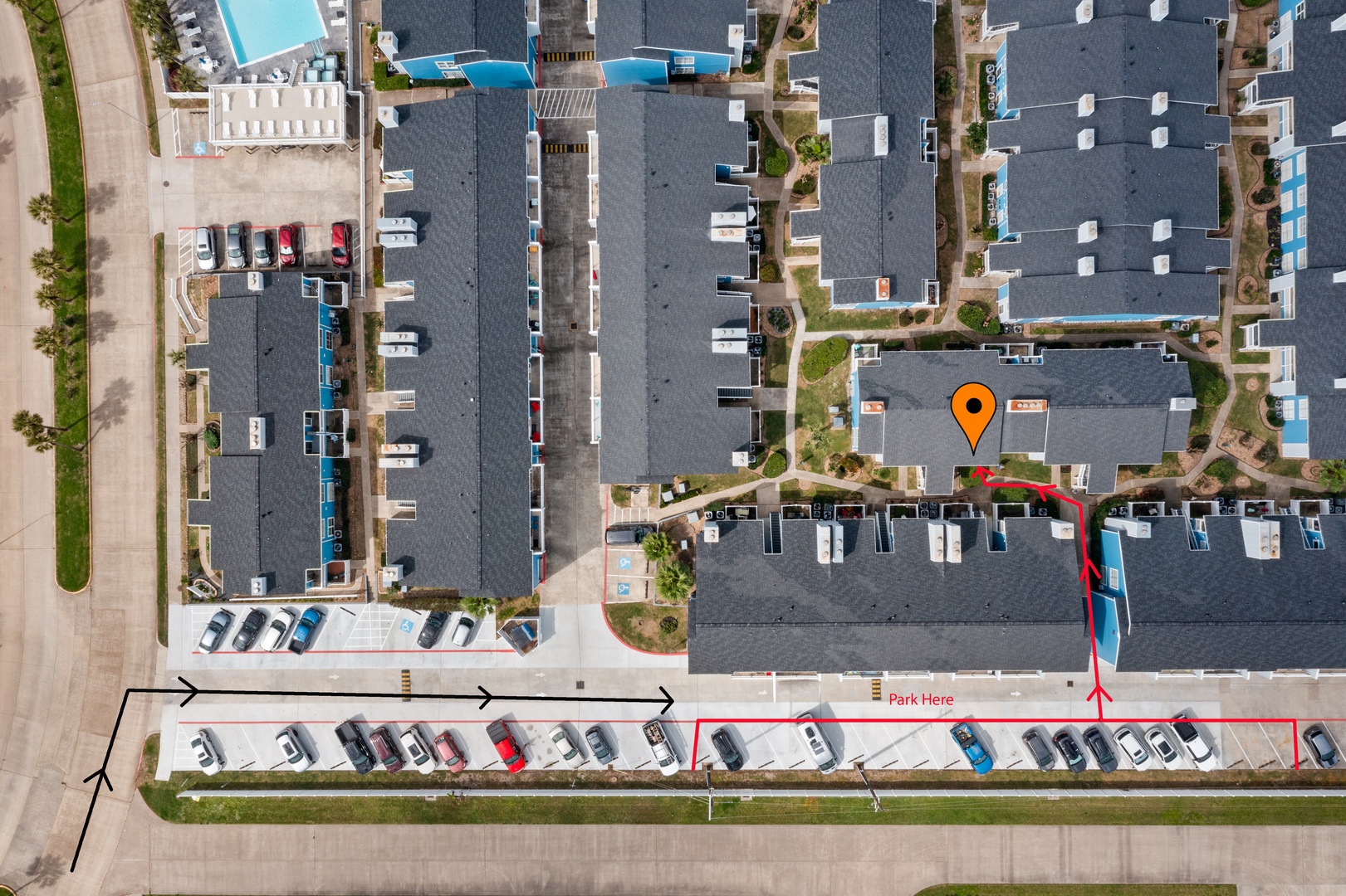 Aerial view of pools, parking & landscaping