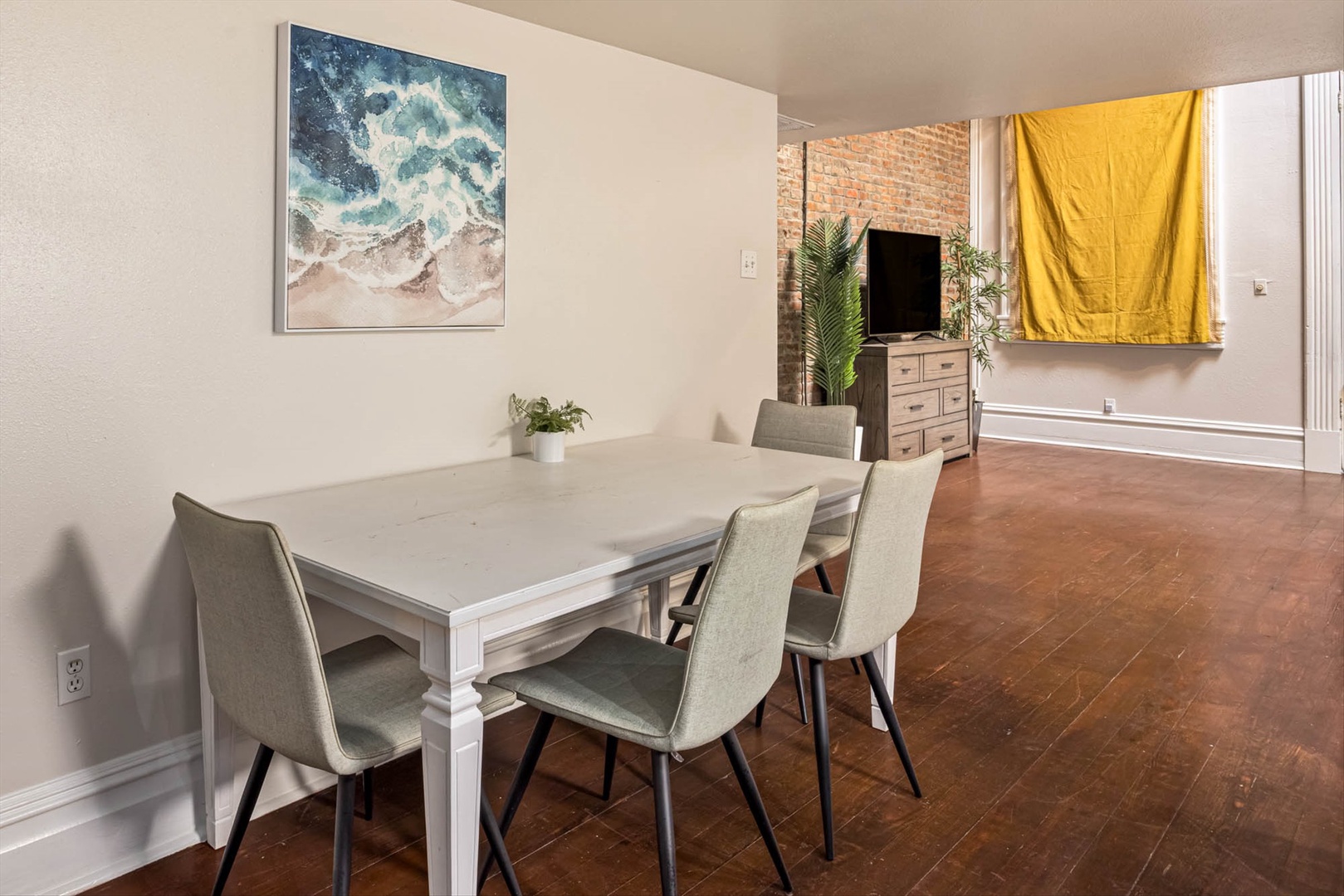 Dining table with coastal art for memorable meals together.