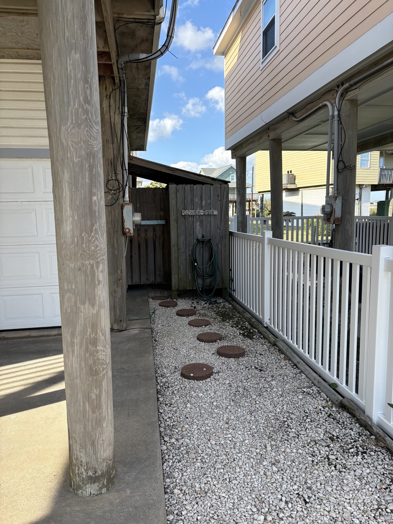 Step into your private outdoor shower to the right of the house downstairs and clean off after a lovely day at the beach