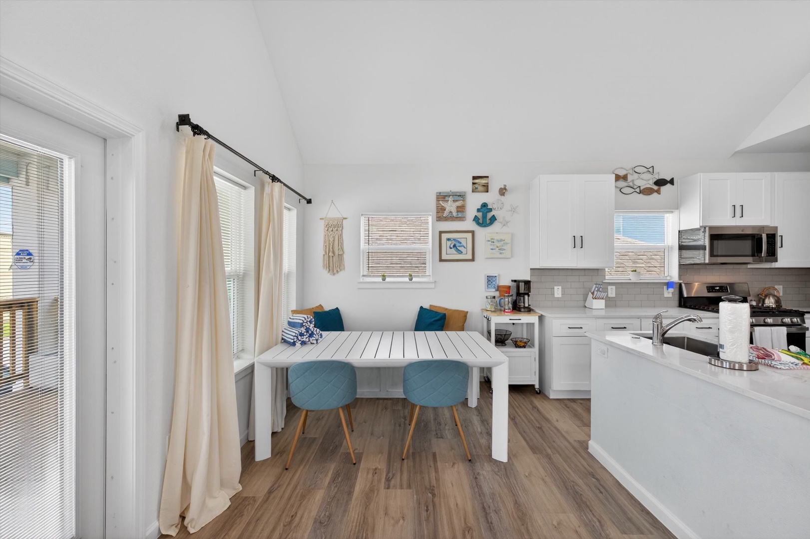 Dining space with coastal charm and kitchen access.