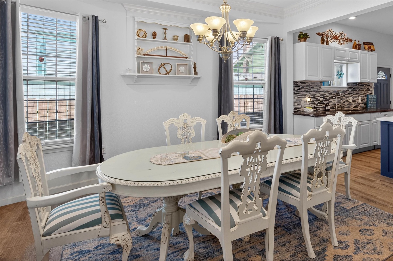 Gather around this elegant dining table for memorable meals together, with your modern kitchen just steps away for easy entertaining.