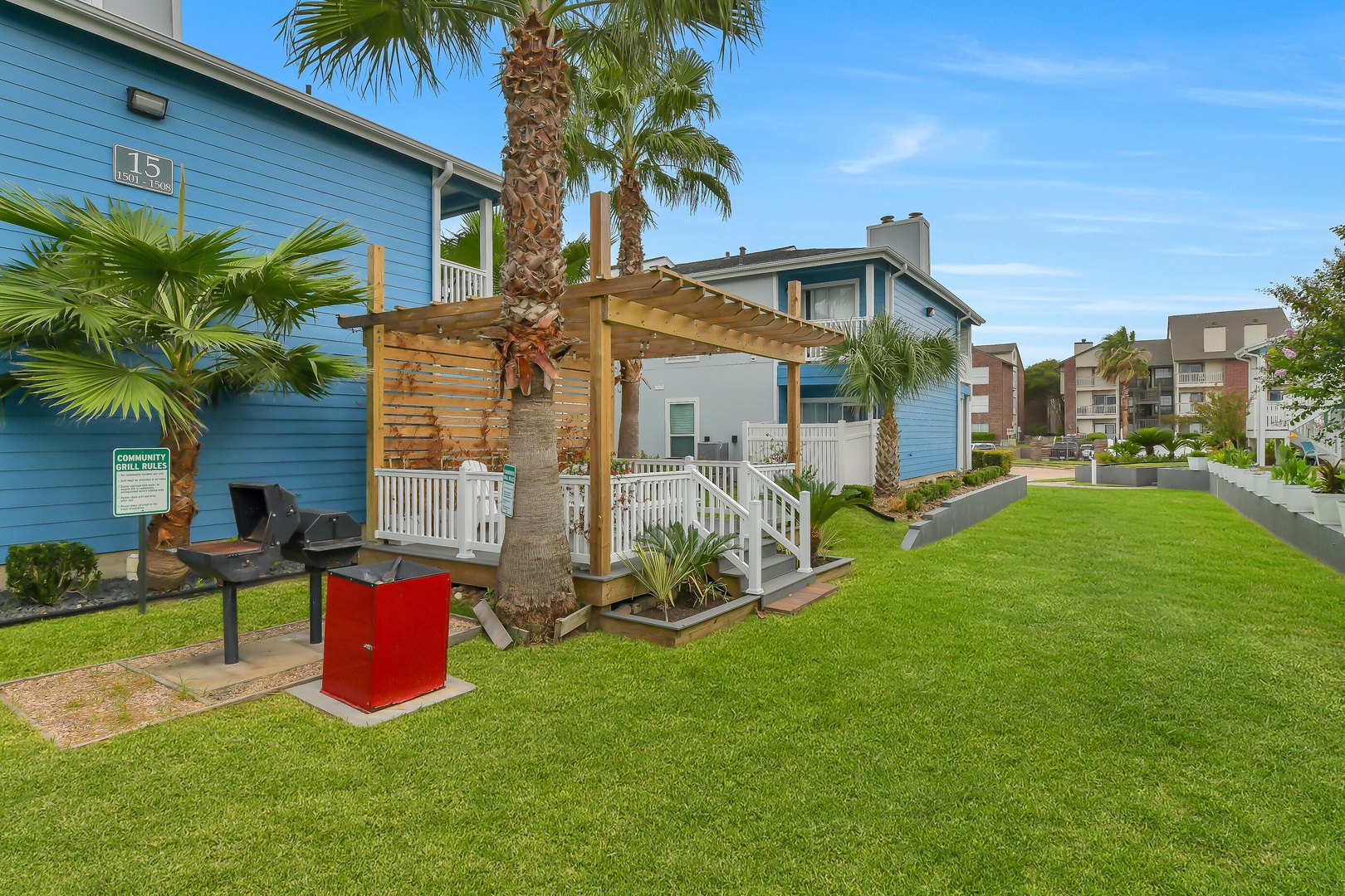 Pergola seating with BBQ facilities and green spaces