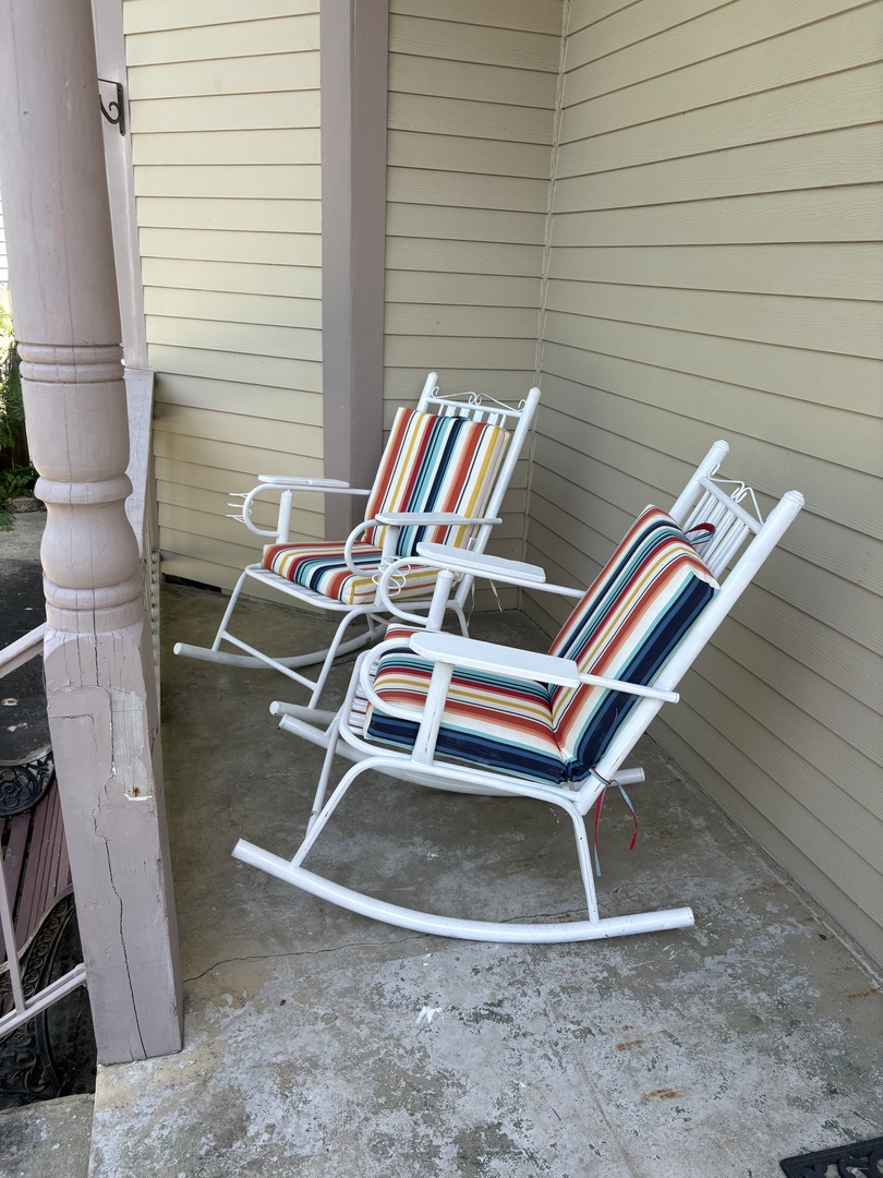 Private deck retreat with striped chairs.
