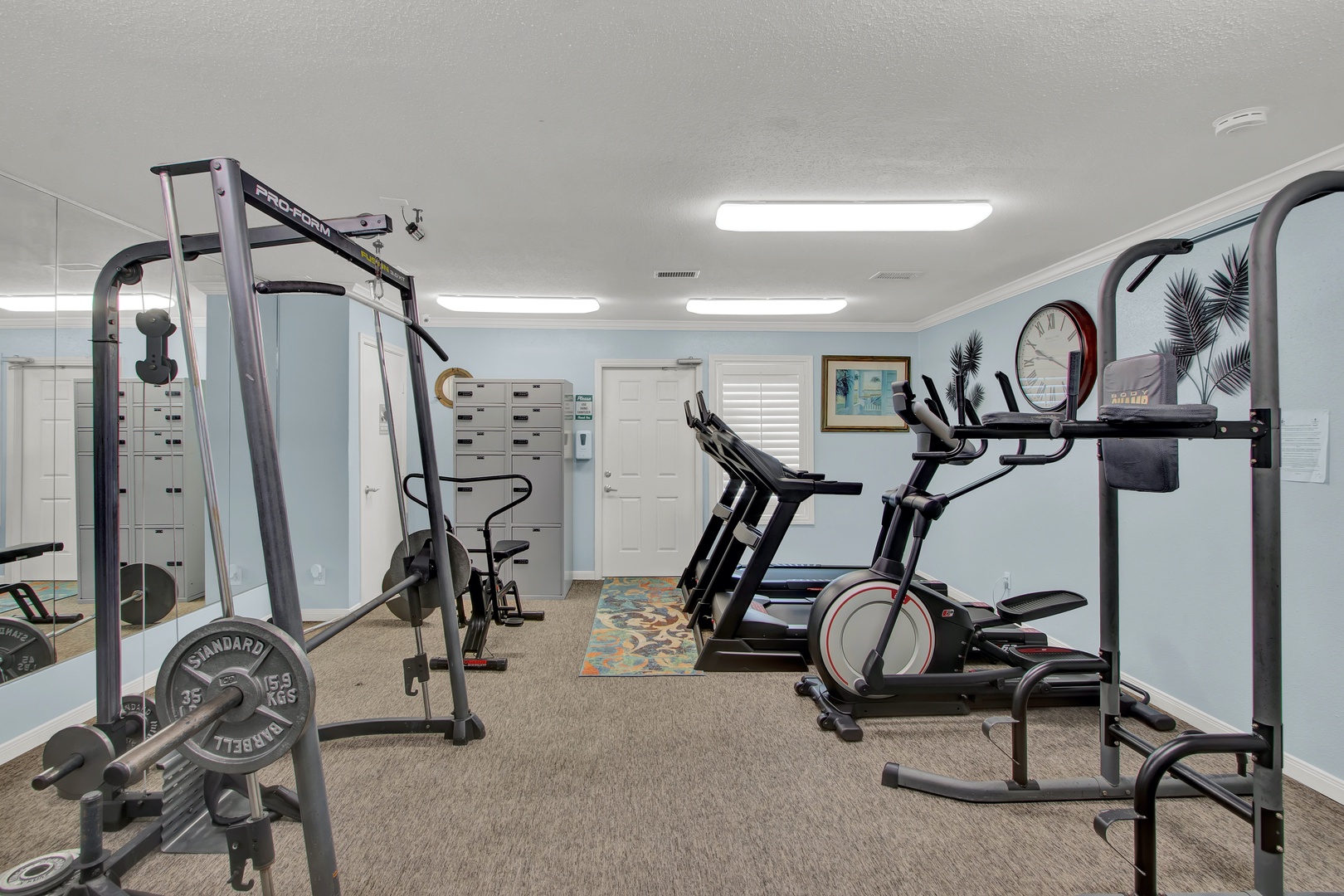 Community fitness room with weights and cardio.