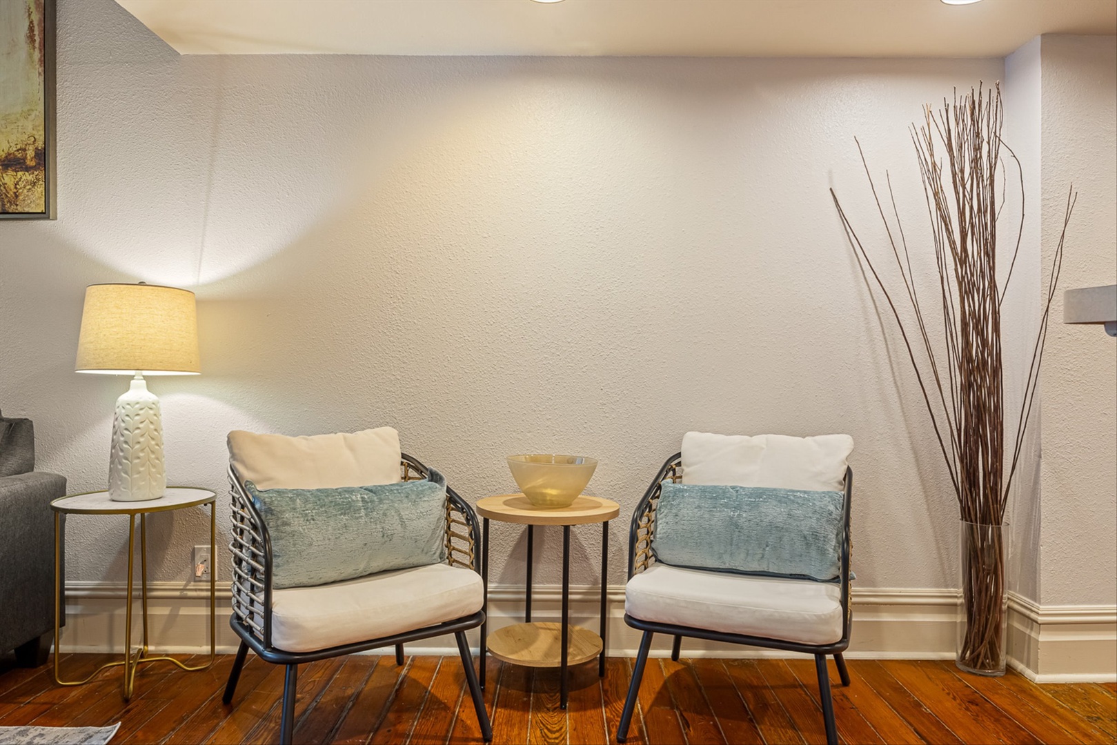 Private reading nook with plush cushions and warm lighting.