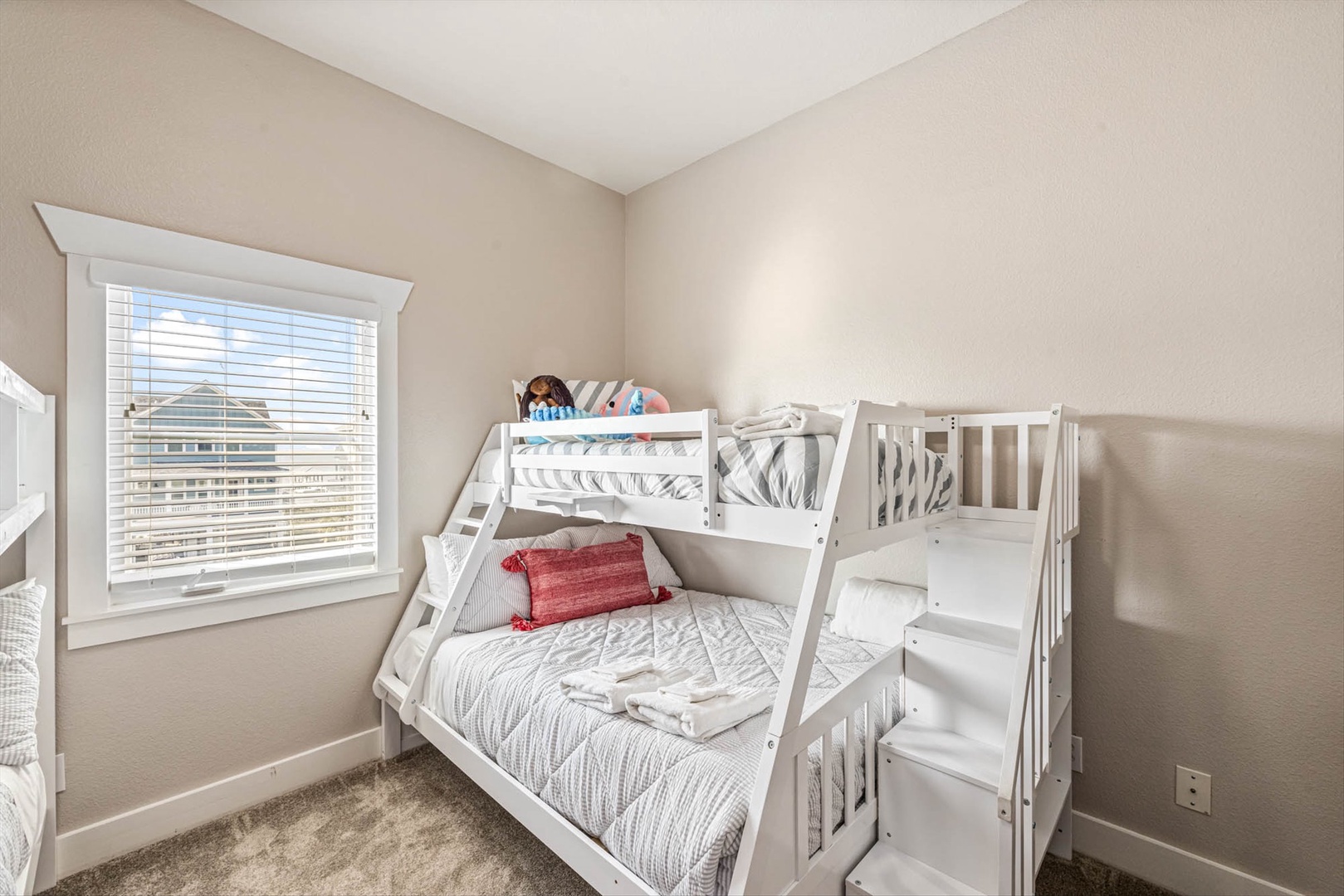 Cozy bunk room with city views, perfect for kids.