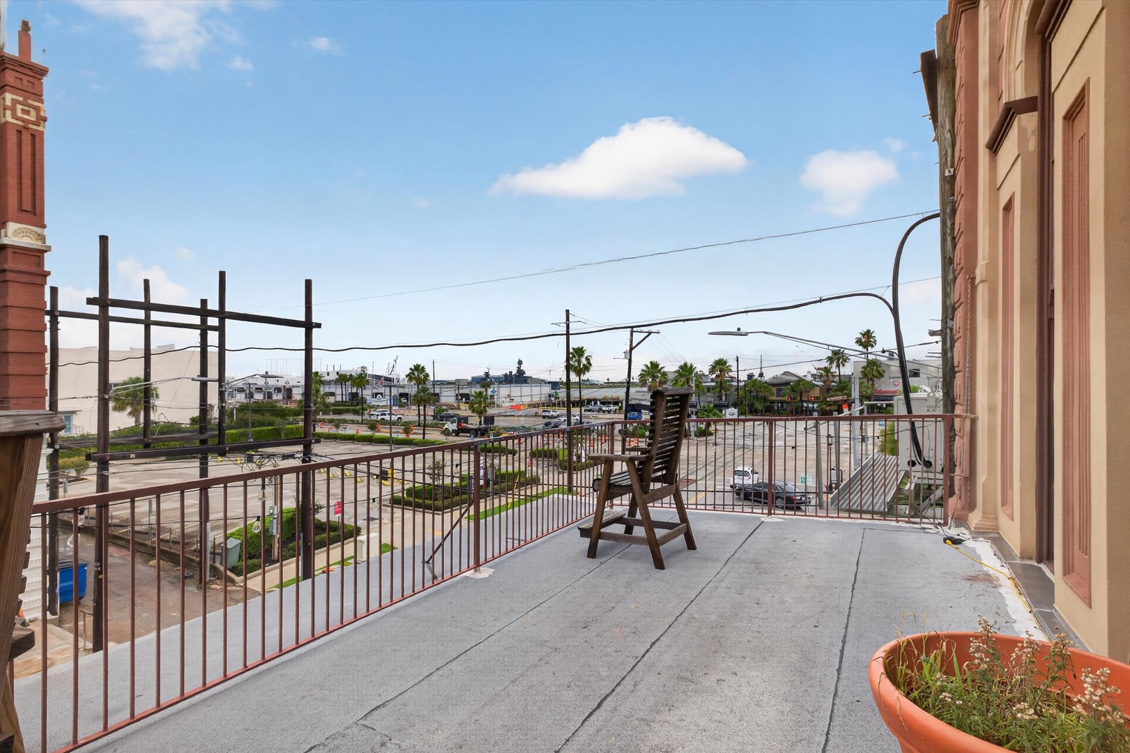 Balcony overlooking neighborhood and cruise port harbor.