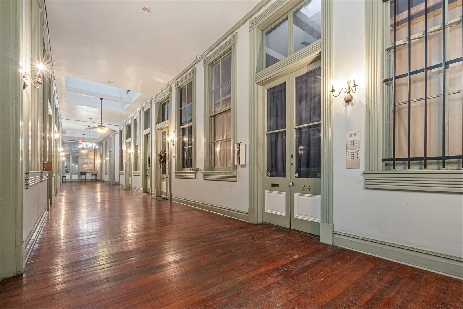 Elegant hallway with gleaming hardwood floors and soft light.