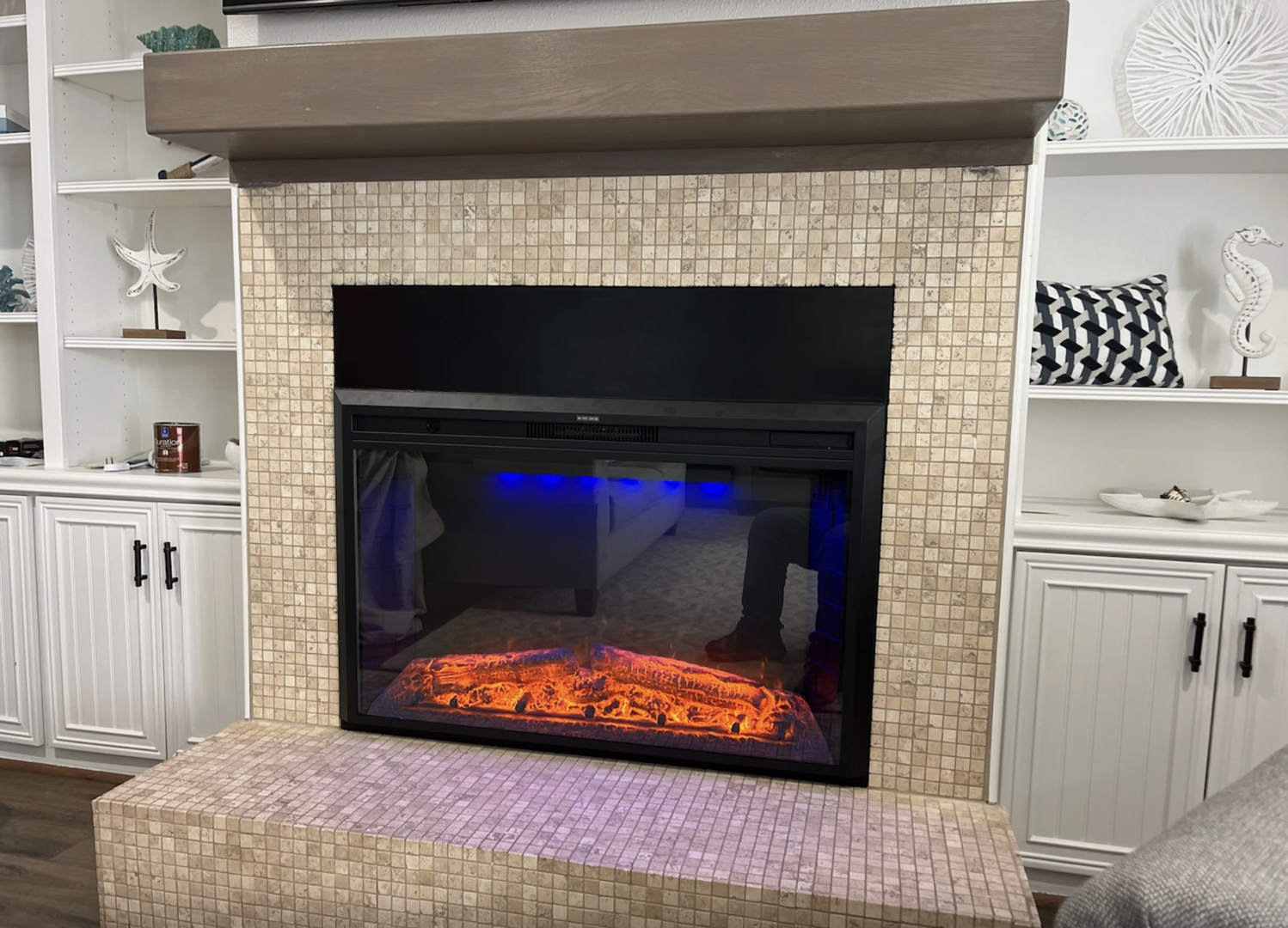 Cozy electric fireplace adds warmth to the living room