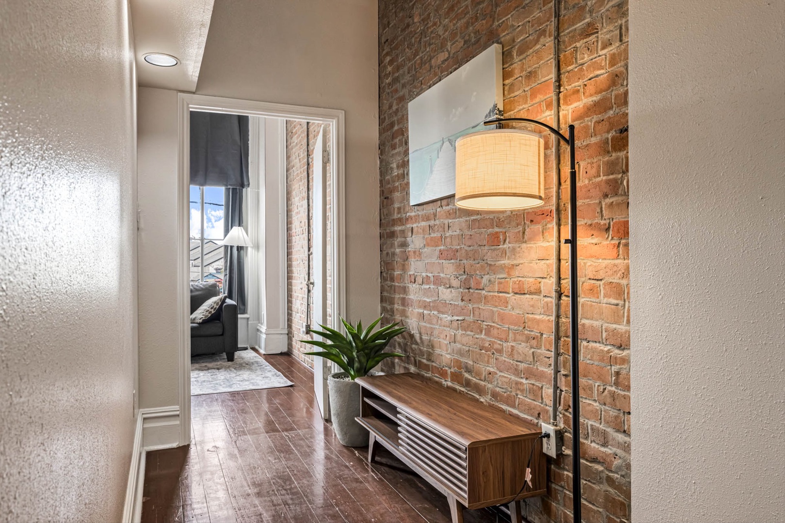 Urban loft with brick walls and cozy warm lighting.