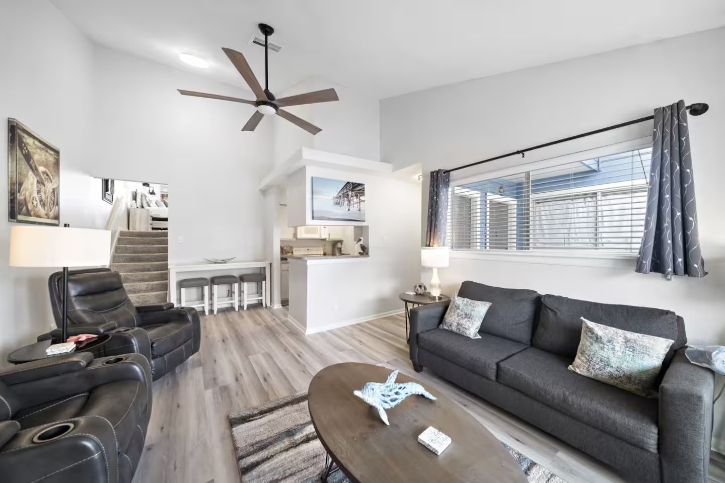 Cozy living room with vaulted ceilings & sunlight