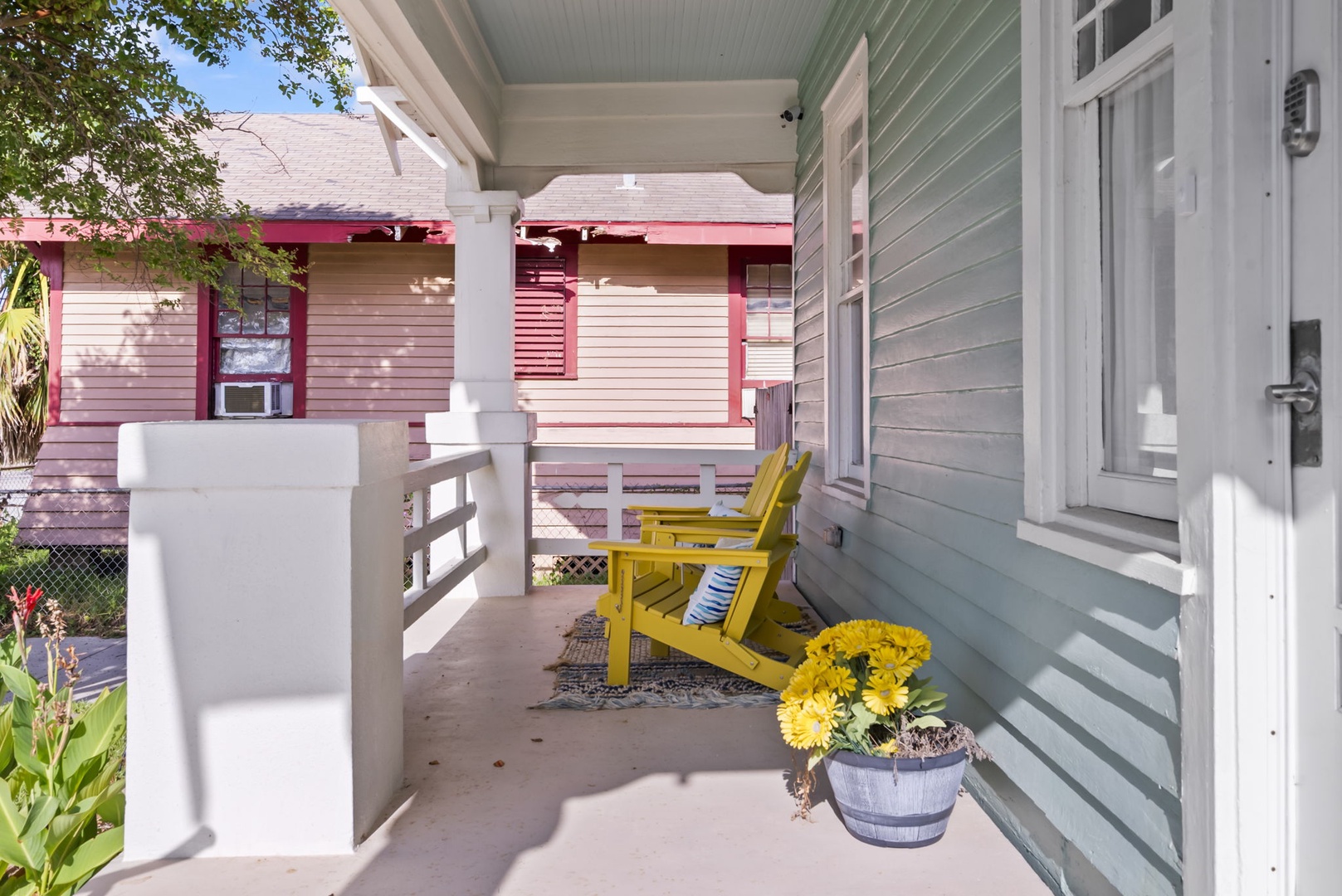 Porch chairs and coastal breeze in a peaceful retreat.
