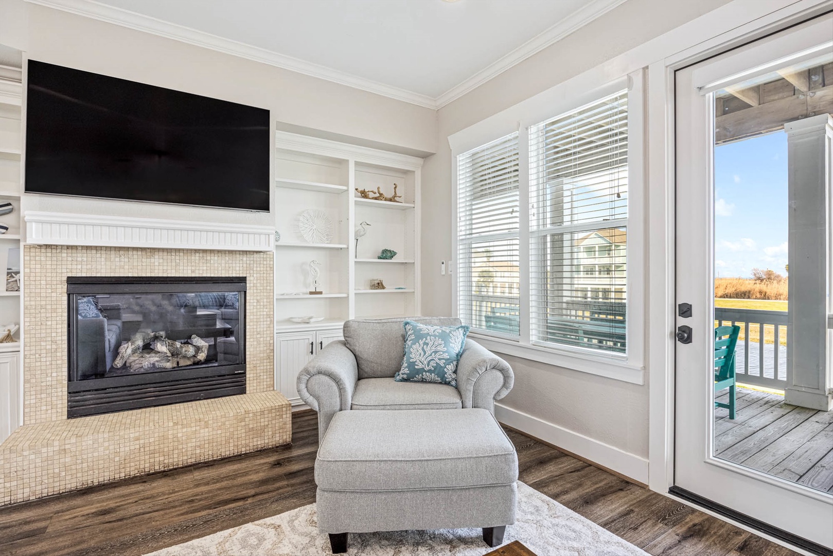 Cozy fireplace with private deck and peaceful views.