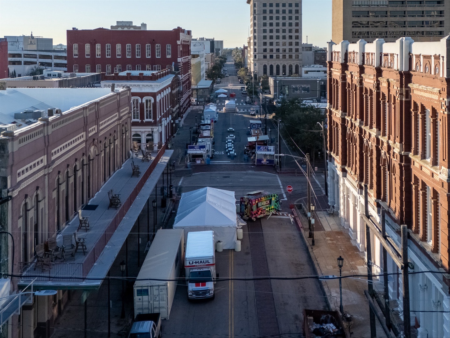 Historic downtown with trees and brick architecture.