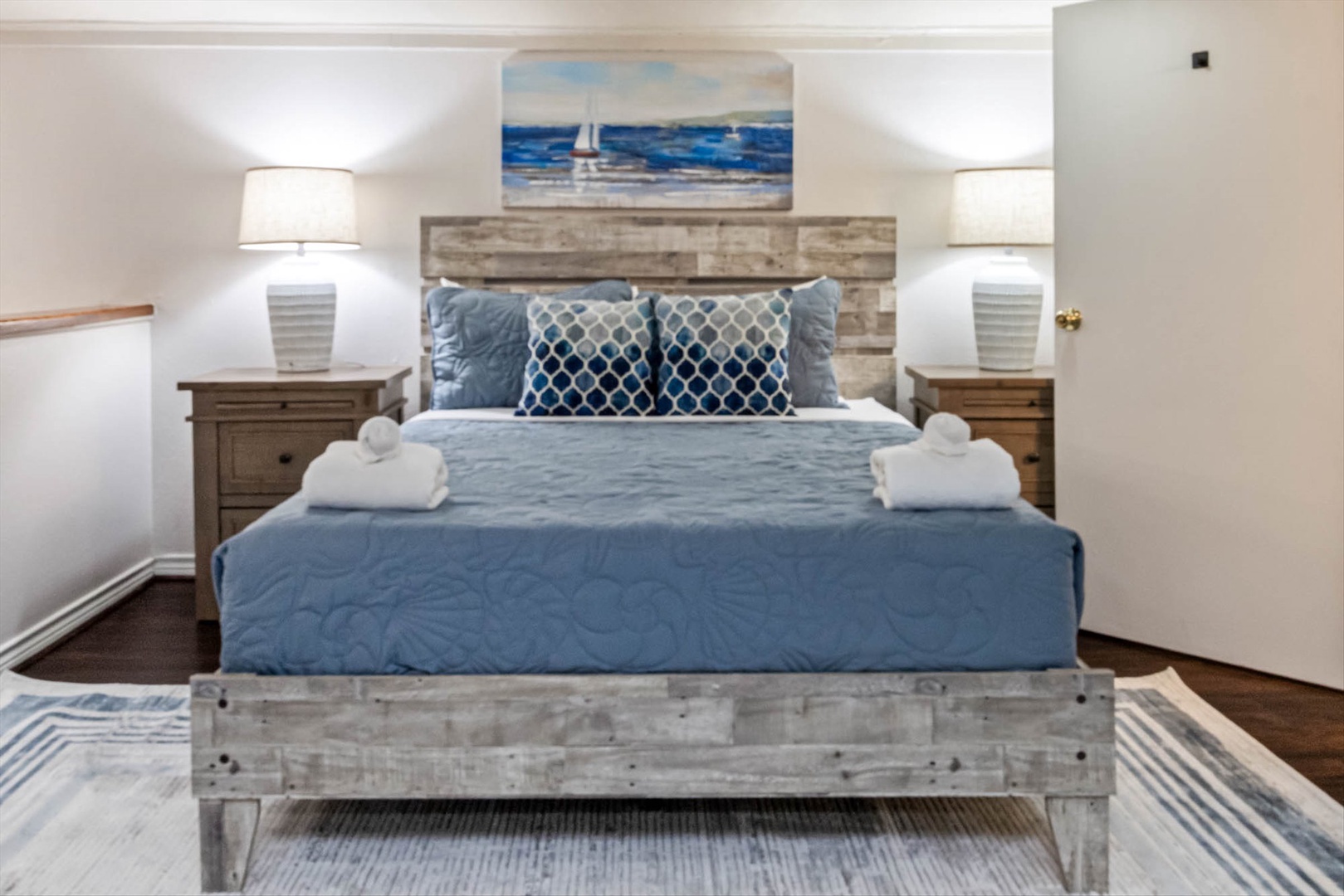 Coastal bedroom with crisp linens and serene nautical touches.
