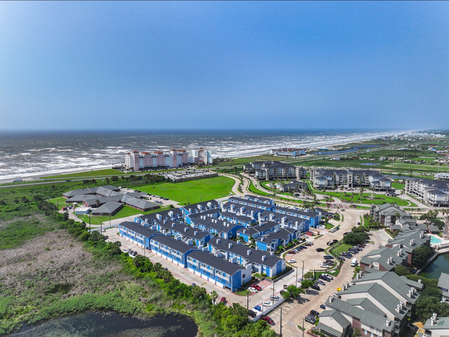 Aerial coastal community with beach access