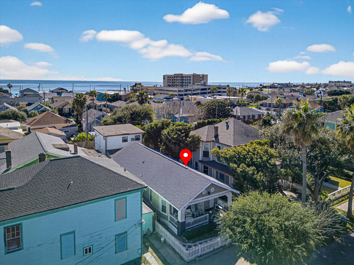 Aerial view of a charming coastal neighborhood with ocean proximity and convenient access to nearby amenities.