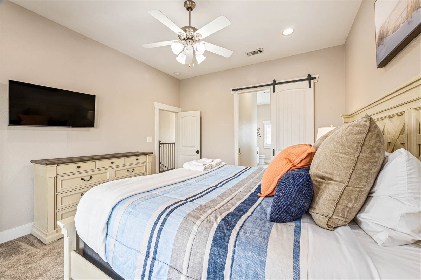 Relax in a cozy bedroom with plush bed and comforts.