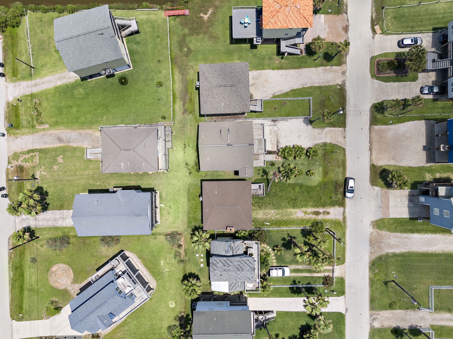 Discover your perfect neighborhood retreat from this stunning aerial perspective! You'll love exploring the peaceful residential area with its charming mix of homes, lush green spaces, and tree-lined streets.