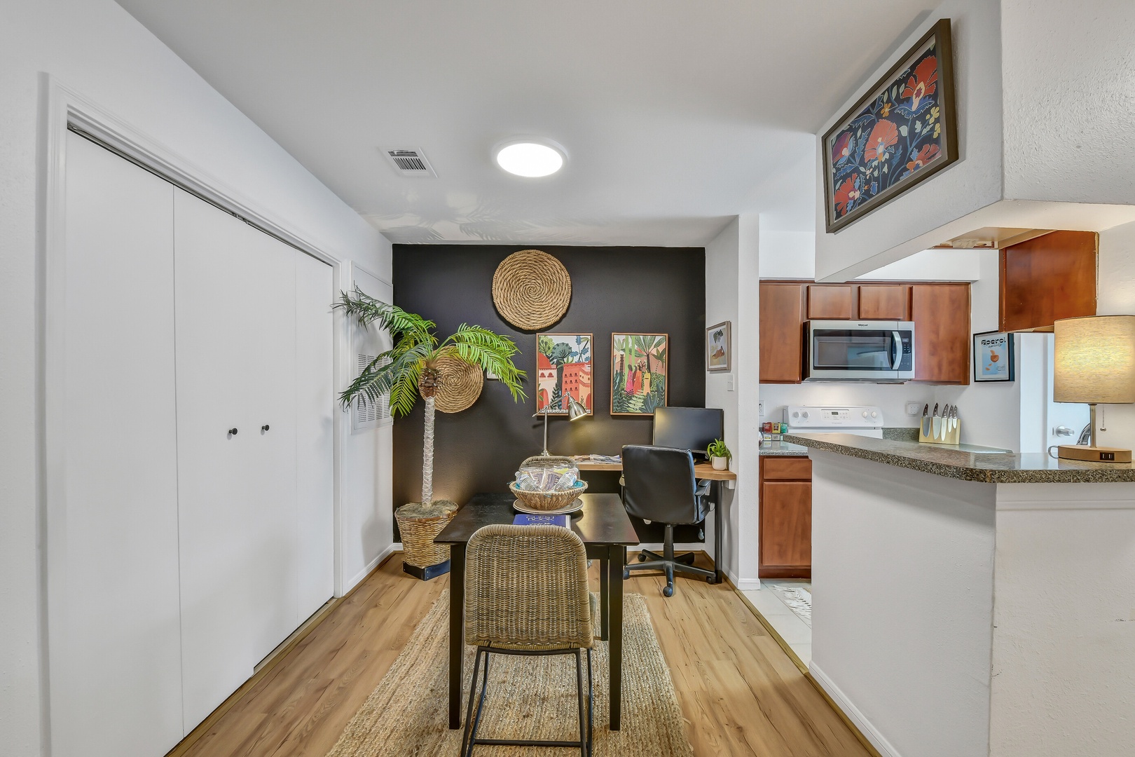 Stylish dining and kitchen area with cozy decor