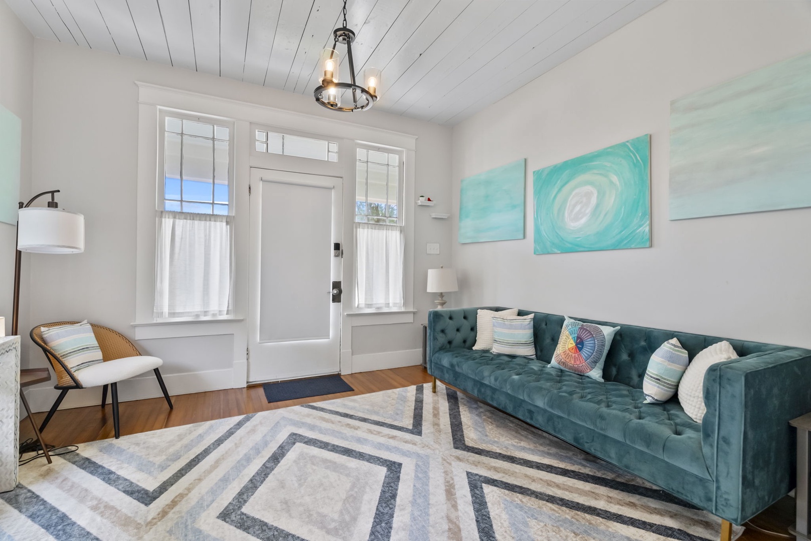 Enter the home and relax in the coastal themed living room.