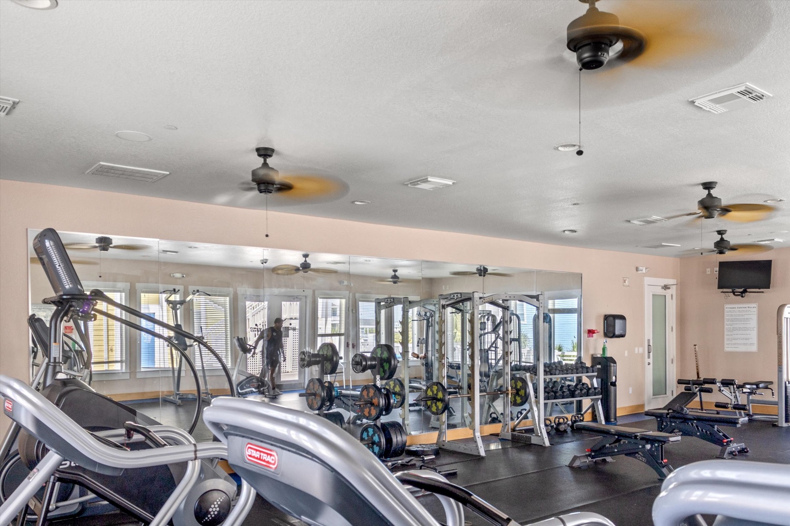 Fully equipped fitness center with cardio and weights.