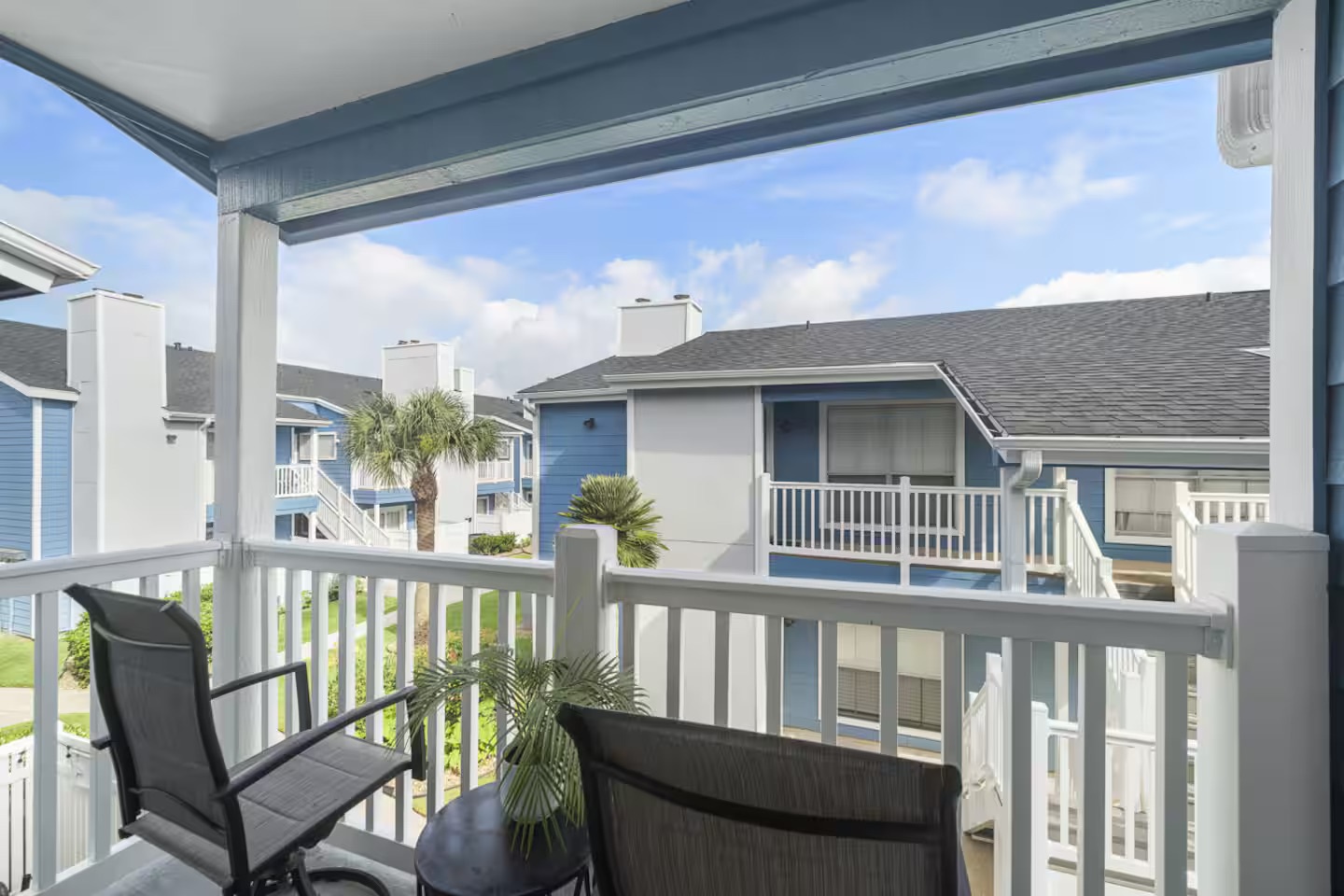 Covered balcony retreat with coastal charm