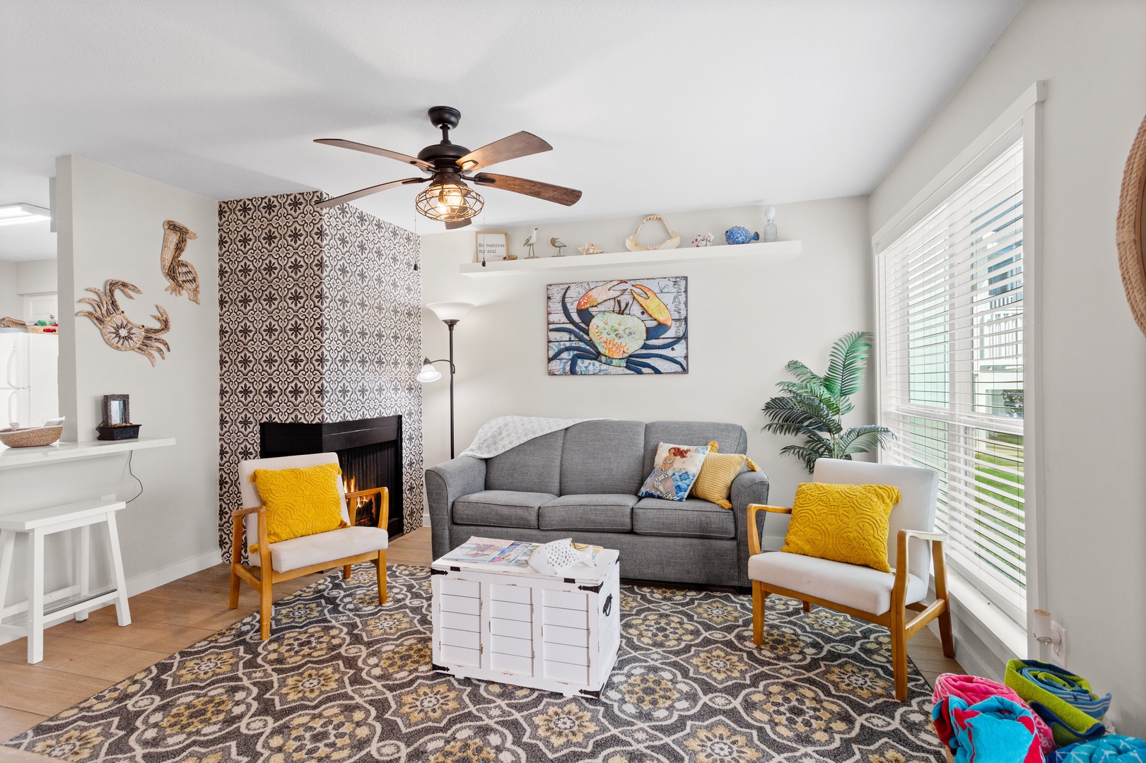 Relax by the fireplace in coastal comfort