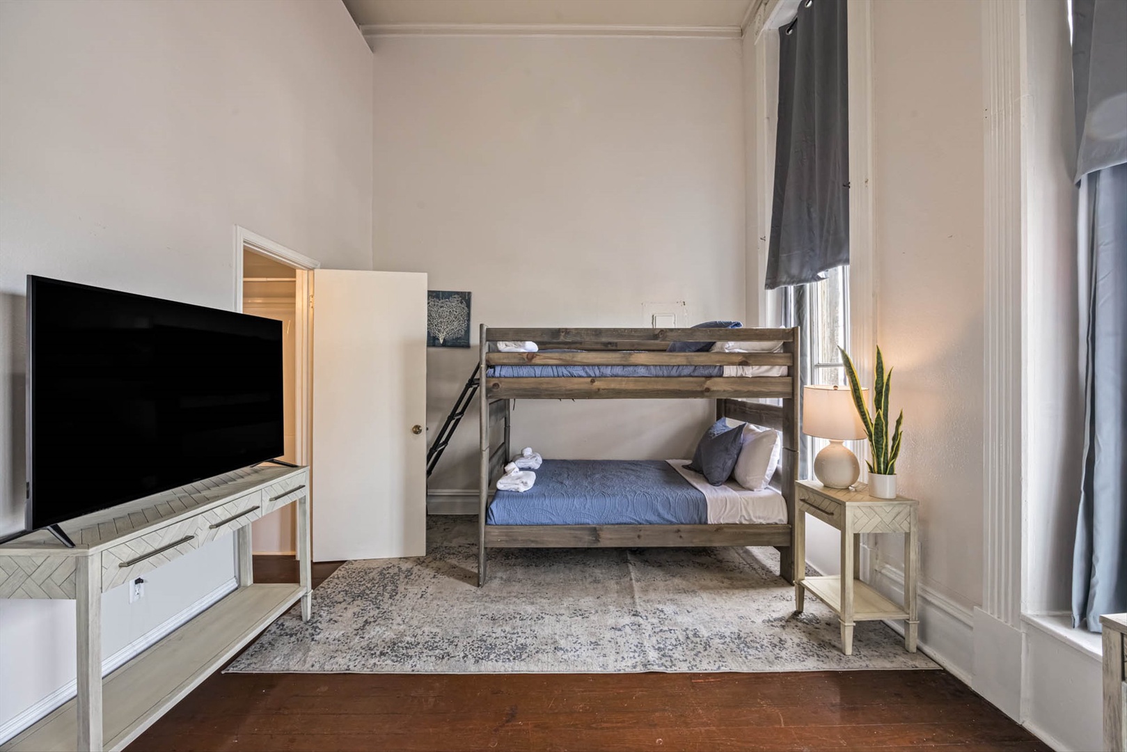 Unwind in a bright room with bunk beds and entertainment.