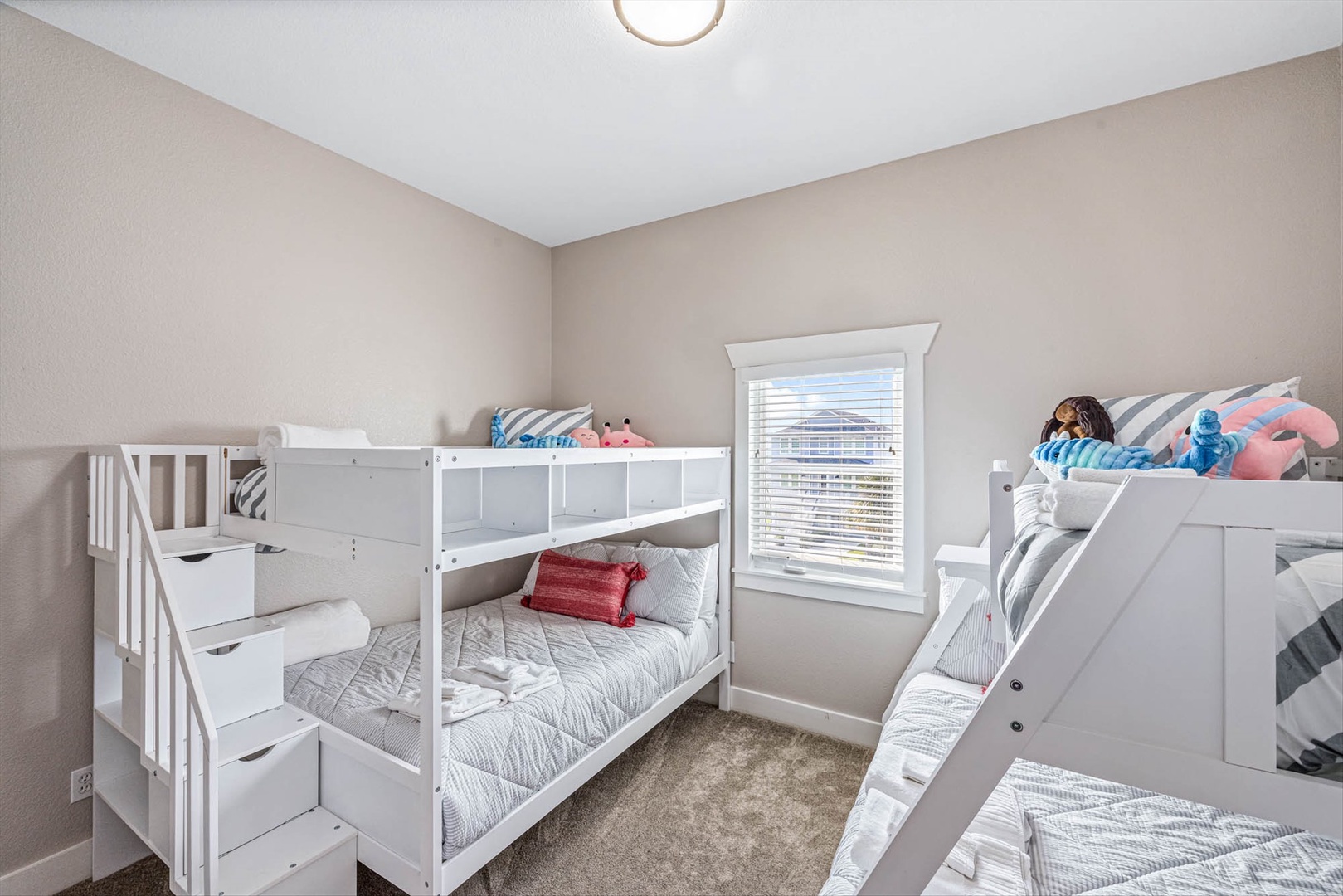 Cozy bunk room with twin beds and built-in storage.