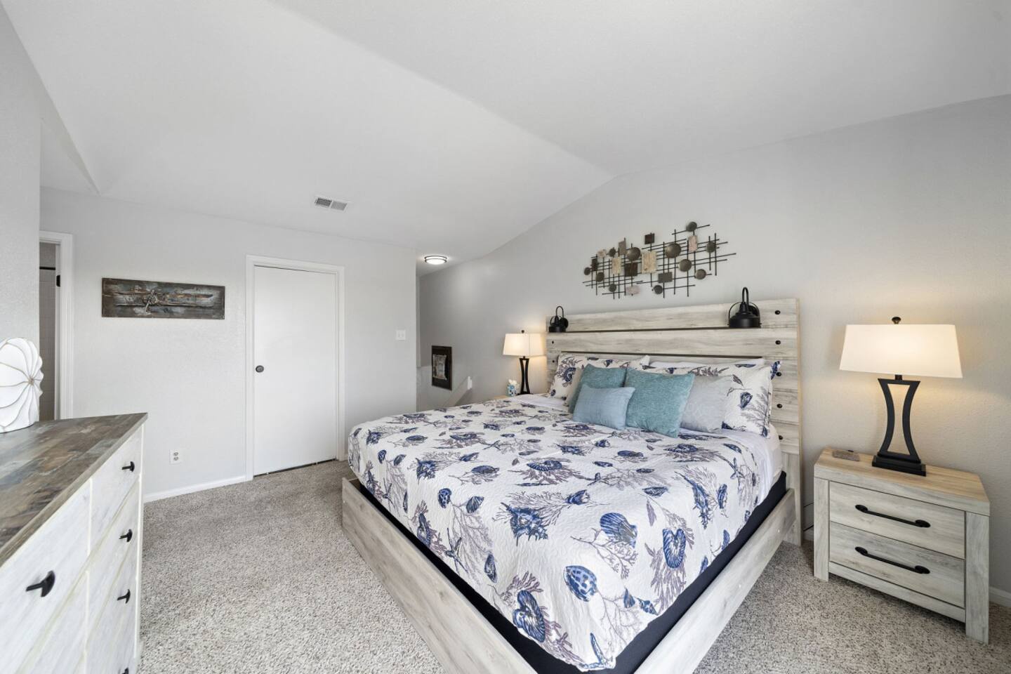 Relax in a bright coastal-inspired bedroom