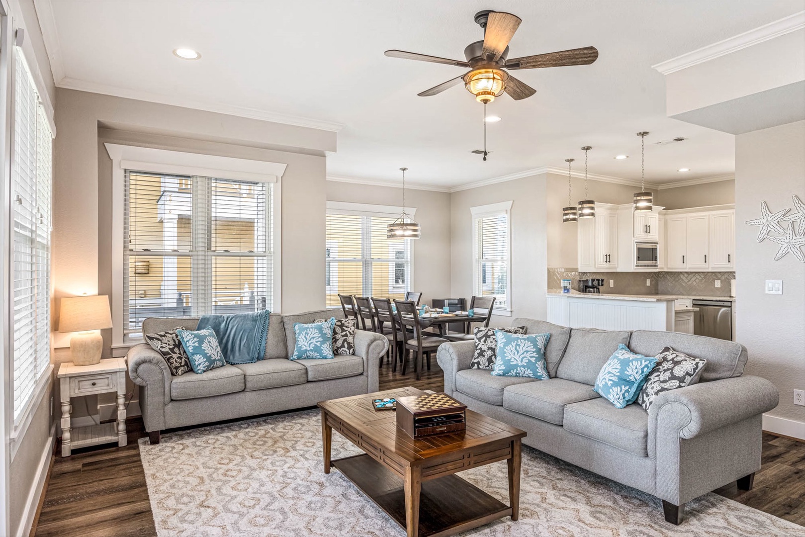 Open living room with plush seating and coastal décor.