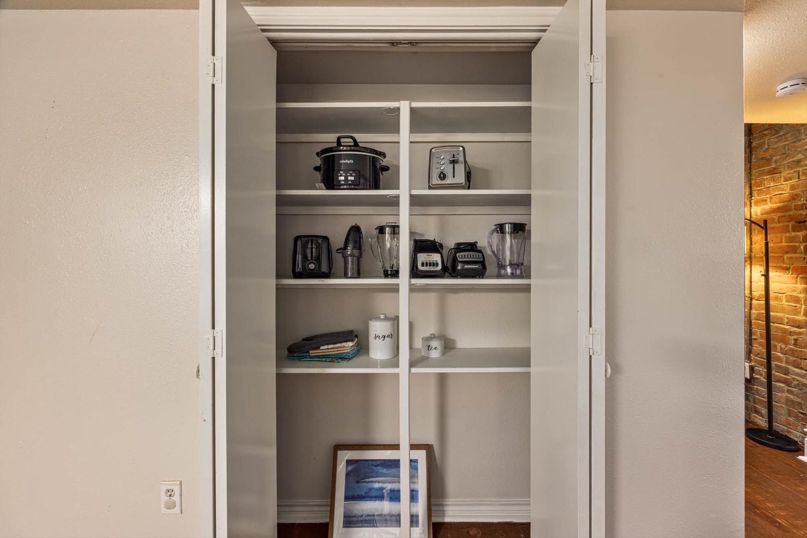 Well-stocked pantry and modern kitchen.