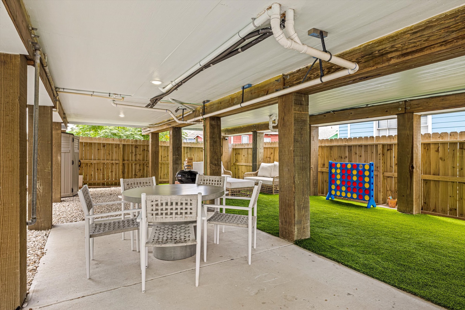 Family-friendly patio with turf and outdoor games.