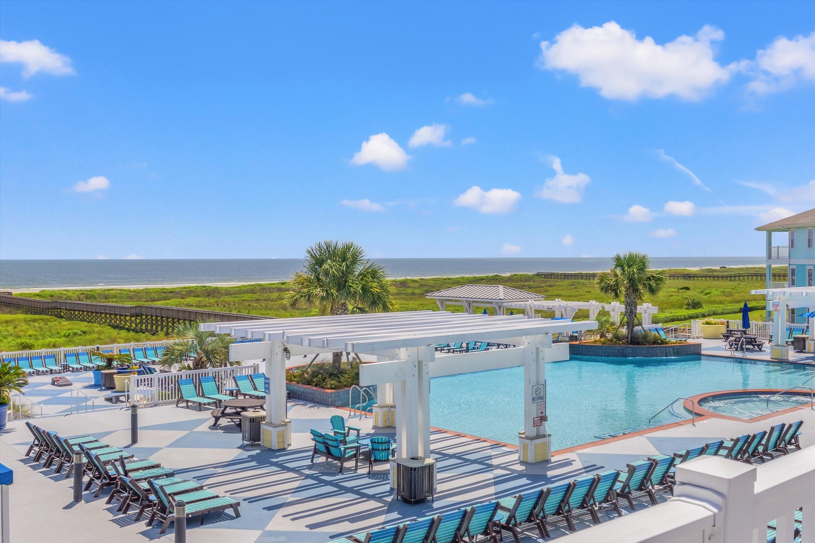 Resort pool with ocean views and coastal amenities.