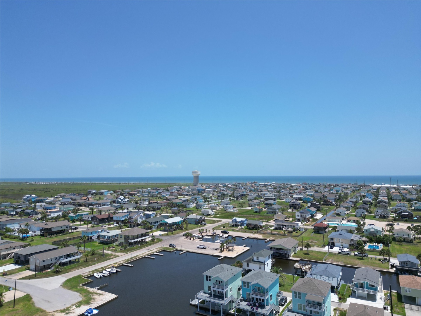 Coastal community view waterfront homes with private boat access.