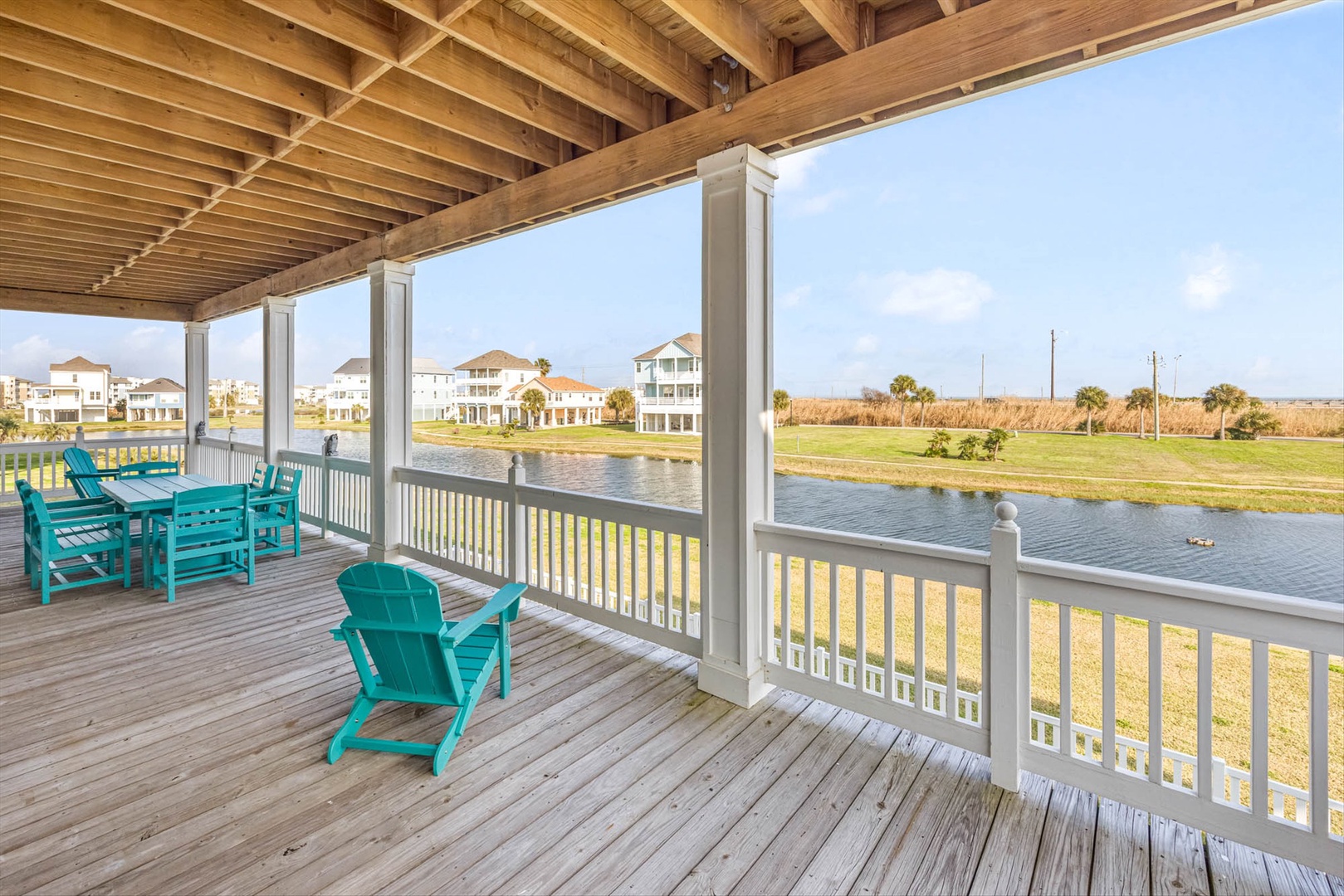 Main back deck with outdoor dining table and seating