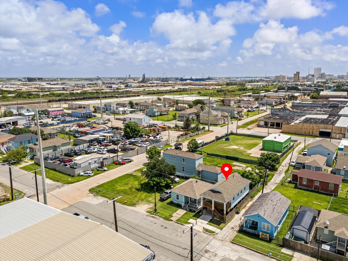 Property nestled in residential area with lawns and homes.