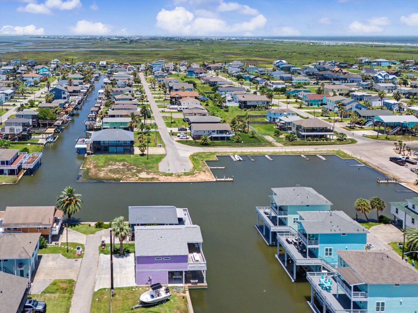 Aerial view of a waterfront neighborhood featuring canal-side.