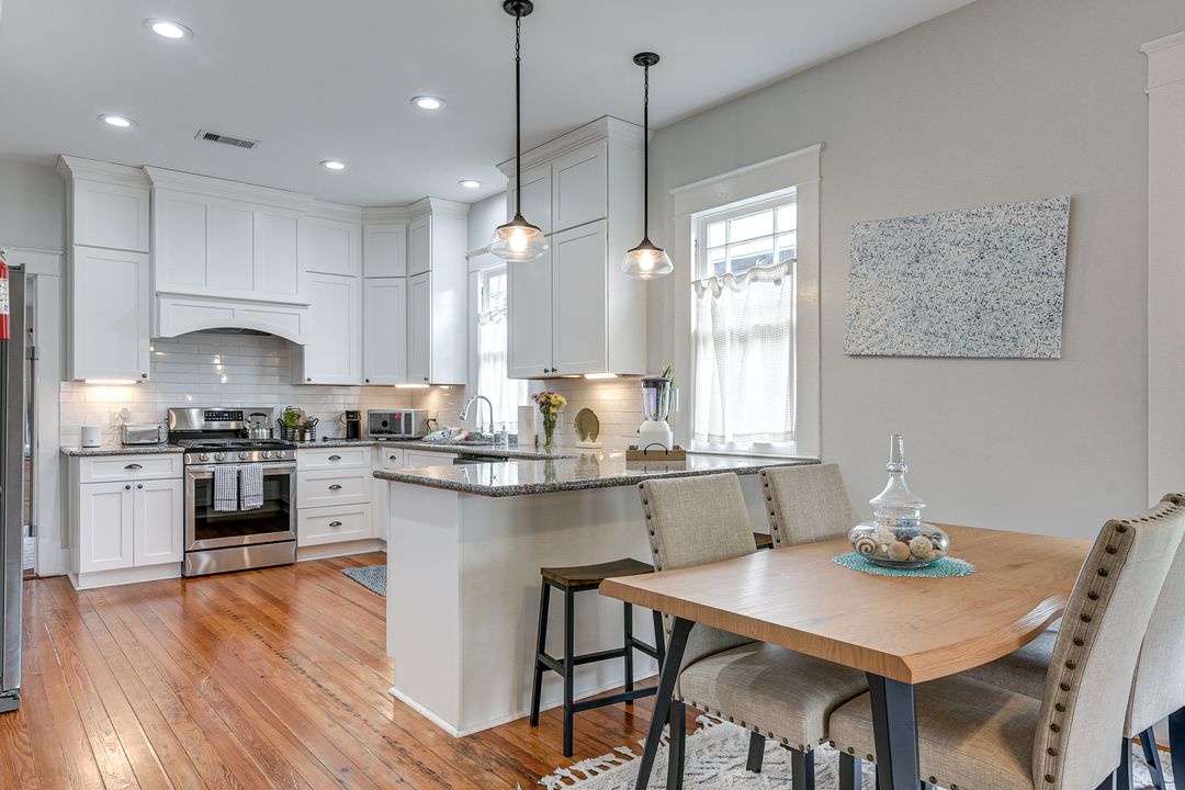 Open space with seating, full kitchen, and dining for six.