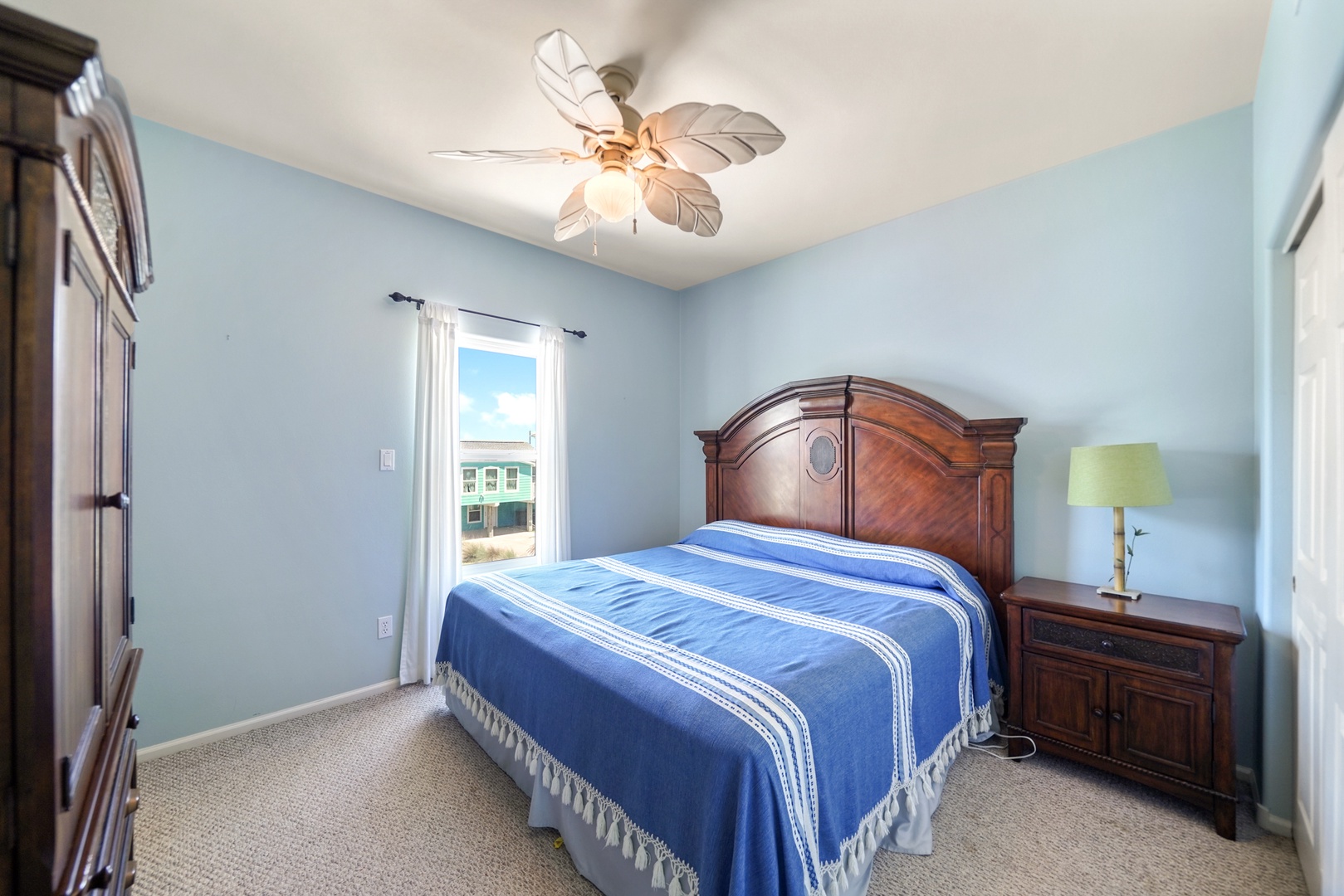 Cozy coastal bedroom with neighborhood views