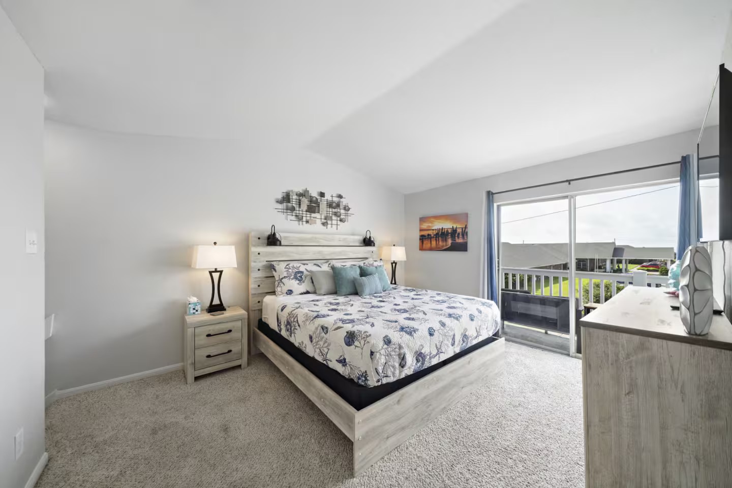 Serene bedroom with balcony and coastal charm