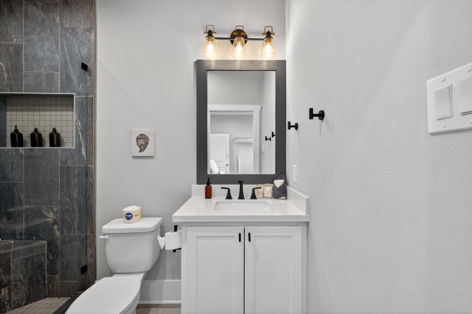 Modern bathroom with stylish tile and walk-in shower.